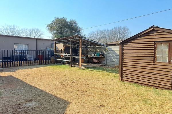 This elegant family home offers three bedrooms with pressed ceilings and original wooden floors, enhanced by laminated flooring in the ...