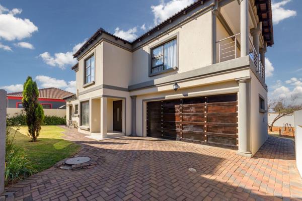 This stunning modern 4-bedroom home features an open-plan lounge and dining area, a ...