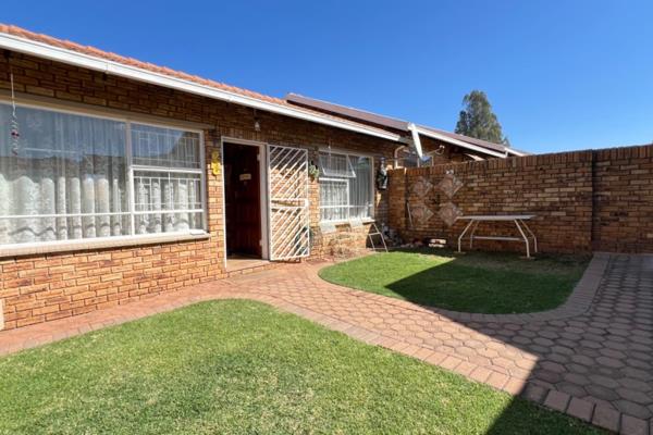 Discover this charming townhouse in Quellerie Park, Krugersdorp, offering comfortable ...