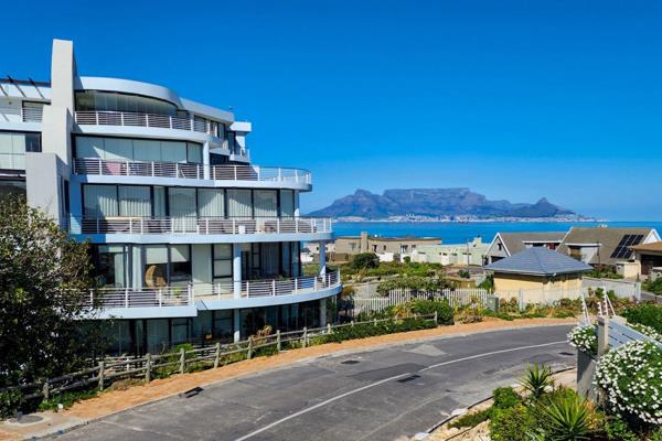 Exclusive mandate. 

This spacious up-market apartment is in the heart of Bloubergstrand Village.  Secure with 24-hour manned security ...