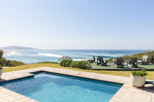 Prepare to be captivated by this stunning beachfront gem in Umzumbe, where the ocean ...