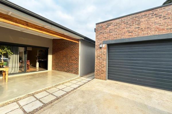 This attractive contemporary styled north facing 3-bedroom residence situated within a ...