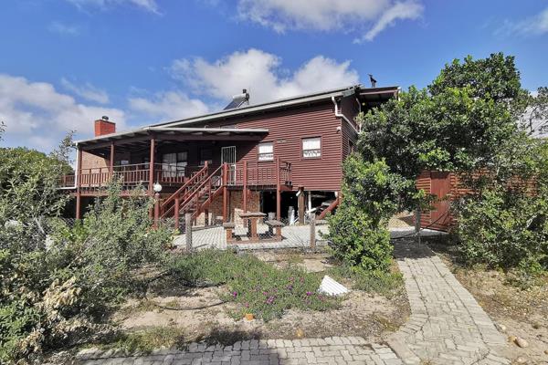 Welcome to this exquisite wooden residence nestled in the tranquil community of Gamtoos ...