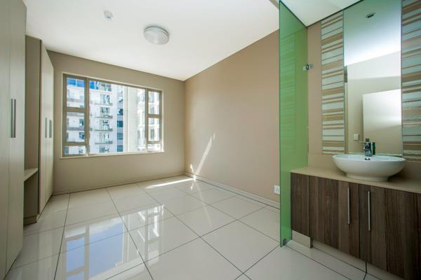 Gaze over the vibrant city of Rosebank in The Tyrwhitt’s luxuriant and spacious 2-bedroom, 2 bathroom apartment. 
Every fixture and ...