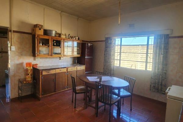 This property offers a cozy main house, fully tiled featuring two bedrooms, a single large bathroom, a functional kitchen, and a living ...