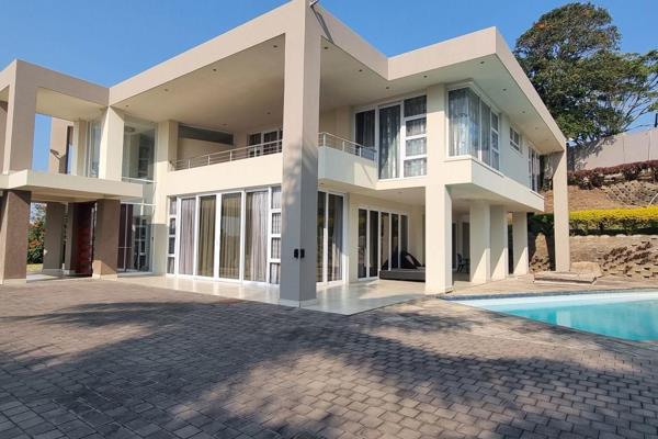 Nestled in an exclusive neighborhood, this luxurious 400m&#178; residence epitomizes ...