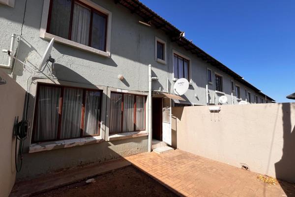 This neat and spacious Townhouse features and open plan lounge and kitchen with built-in ...