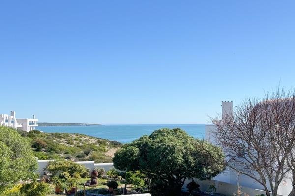 Discover this stunning four-bedroom home nestled within the exclusive Paradise Beach ...