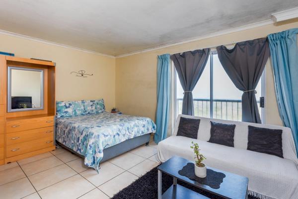 Introducing your coastal refuge in Costa da Gama - a bachelor apartment nestled amidst panoramas of False Bay and the majestic ...