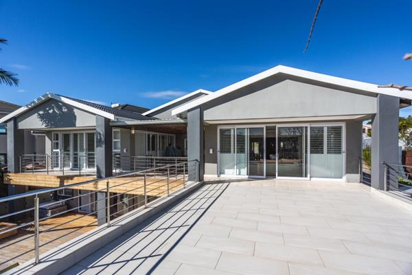 From the moment you walk through the illuminated internal wooden walkway entrance hall into the main living level with a large open ...