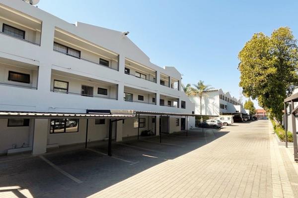 Kitchen with ample cupboards and space for washing and single-door fridge.
Open-plan living area that leads to covered balcony.
1 tiled ...