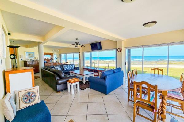 This breathtaking double story home offers the epitome of coastal living, with ...