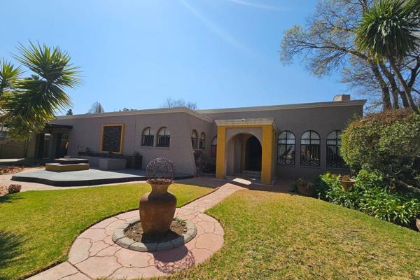 Spacious 4-bedroom home with modern amenities, featuring 2 lounges, a dining room, breakfast nook, office, and scullery. Enjoy the ...