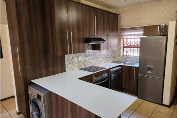 This 2-bedroom garden townhouse in the heart of Sunninghill offers it all!

 A new kitchen, with modern hob and oven and space for 3 ...