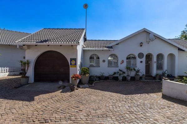 Presenting a charming family residence located on a large plot within a bustling neighbourhood, ideally positioned between Johannesburg ...