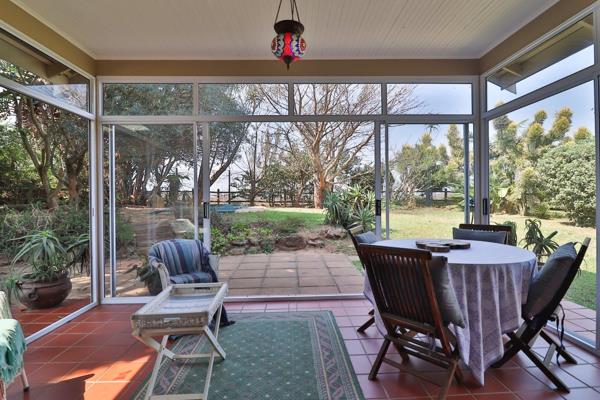 DUAL MANDATE  Open plan living spaces open out onto a sun room which accesses a generously proportioned garden and swimming pool.  ...