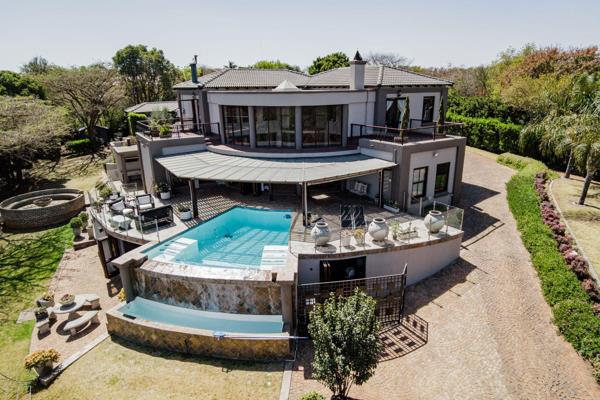 This beautifully designed home, located on one of the highest hills in Mooikloof ...