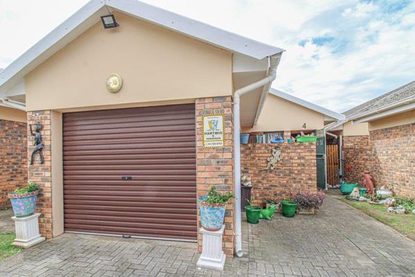 This low maintenance face brick townhouse is conveniently situated in a secure, well run ...