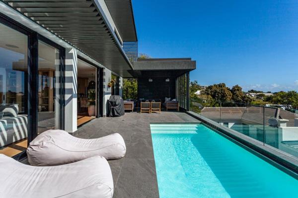 Welcome to Central Crest, a contemporary three-story haven nestled in the heart of Camps Bay. This stunning modern residence boasts ...