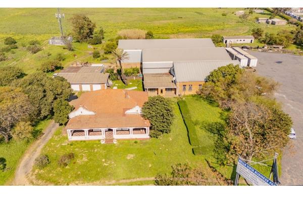 Situated on the R101close to Koelenhof, this expansive 1.6-hectare property offers a unique blend of agricultural zoning and commercial ...