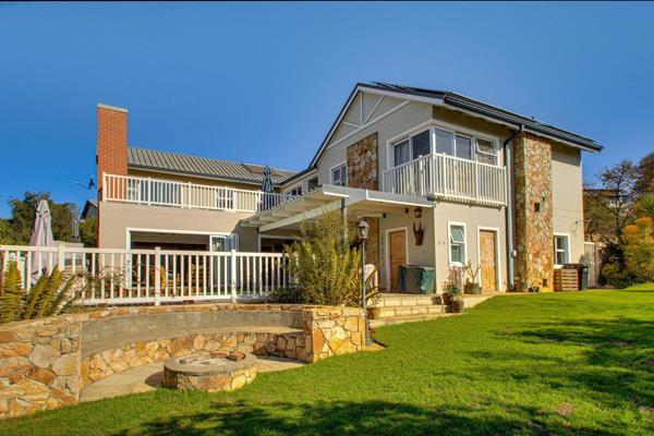 Nestled within the prestigious Helderfontein Eco-Estate, this stylish 4-bedroom family residence offers a perfect blend of luxury ...