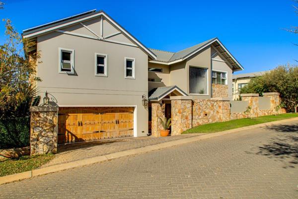 Nestled within the prestigious Helderfontein Eco-Estate, this stylish 4-bedroom family residence offers a perfect blend of luxury ...