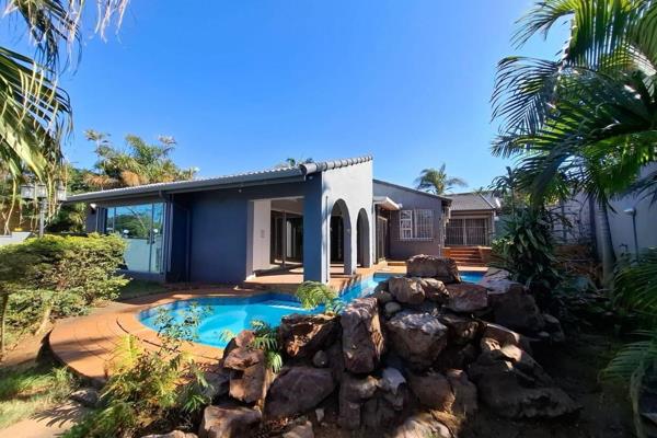 This spacious home features large living areas and a fitted kitchen with a breakfast nook, the main living area is tiled and the ...