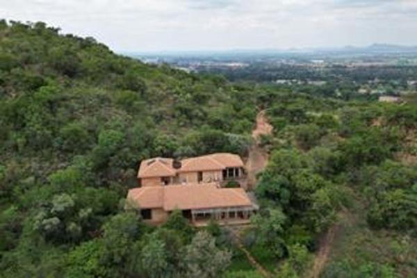 Untaimed mountain retreat on 2.25-hectare, located in a Secure Estate, with magnificent views of the Magalies mountains and a nearby ...