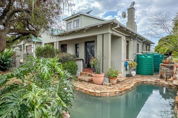 The home offers a large family-size kitchen, seamlessly flowing into the lounge and dining area, creating a warm and inviting space for ...