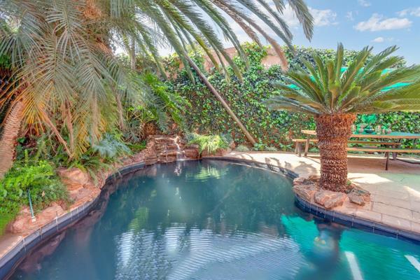 Welcome to your tropical paradise! Step through the inviting entrance and discover a home full of delightful surprises. The sunken ...