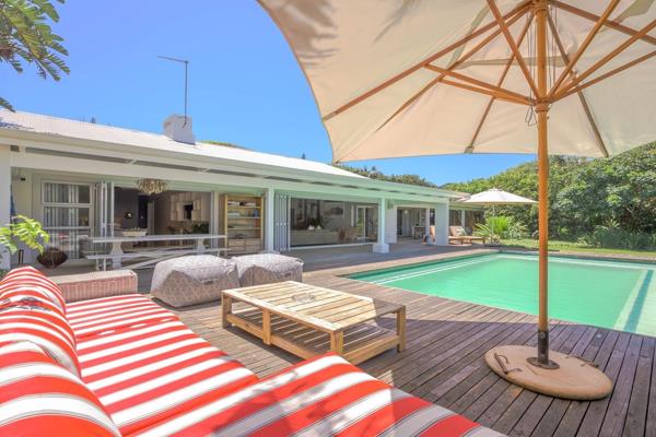 Introducing a rare opportunity to own one of the most beautifully located homes on the KwaZulu-Natal north coast. This modern and ...