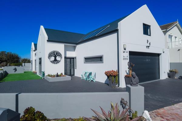 This stunning contemporary home in Yzerfontein, just a short stroll from the beach ...