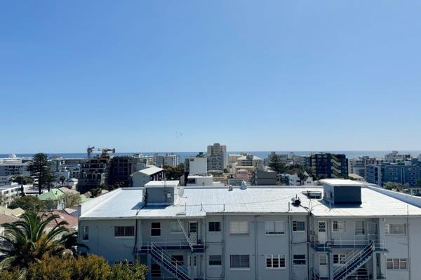 Exclusive...This 40m2 studio is perched high up in Sea Point. Exceptional ocean views and a balcony. The apartment is light and bright ...