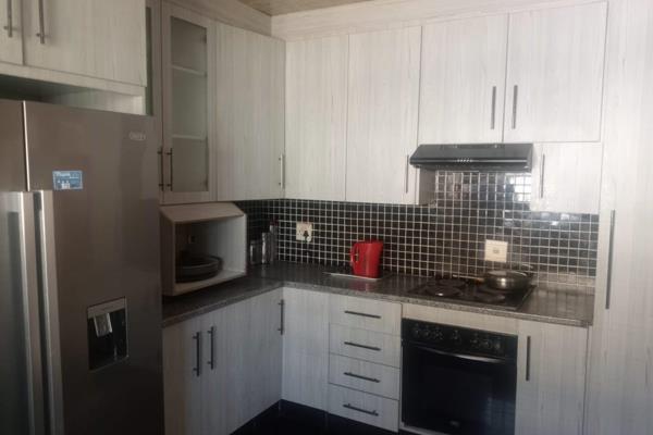 Very spacious three bedrooms house with flat at the back.
Modern kitchen
This property have double garage and borehole.