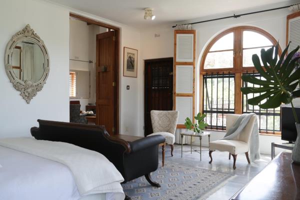 This eclectic villa was built incorporating reclaimed hundred year old Cape teak windows ...