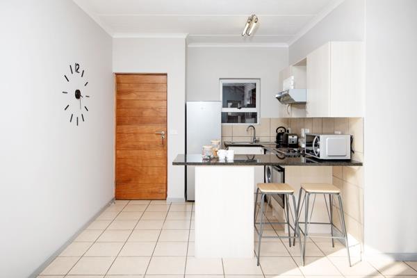 Modern, open-plan kitchen with a breakfast nook leading into the lounge/dining room. One full bathroom with a shower and a bathtub. ...