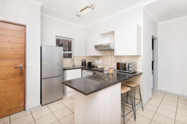 Modern, open-plan kitchen with a breakfast nook leading into the lounge/dining room. 

One full bathroom with a shower and a ...