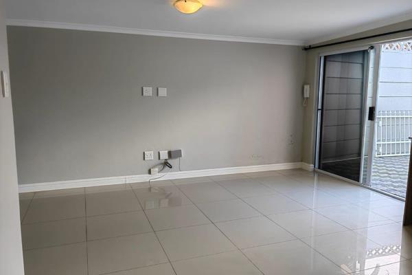 The open floor plan offers a comfortable living space  leading to fitted open plan  ...