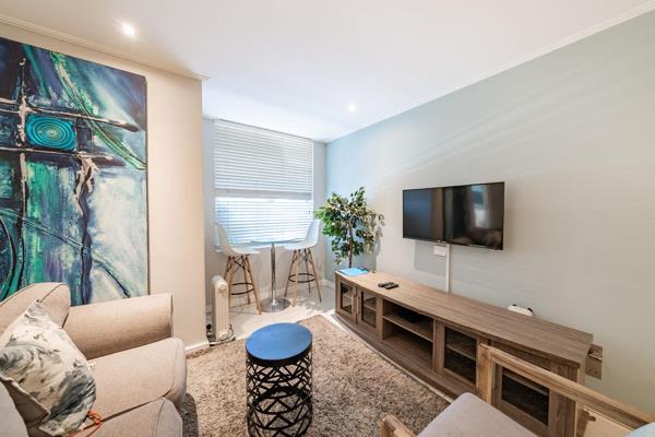 Welcome to this stunning apartment in the heart of Rosebank, where you&#39;re greeted by a modern open-plan lounge and dining area that ...