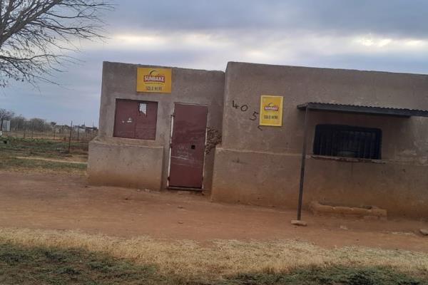 A vacant stand is up for sale at a business center with a Turkshop  in Hammanskraal Maubane Village, water is available.