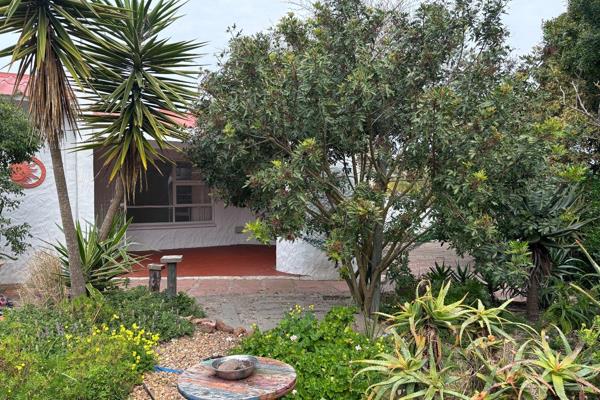 This little 2 bedroom home with a bird lover&#39;s garden is situated in Port ...