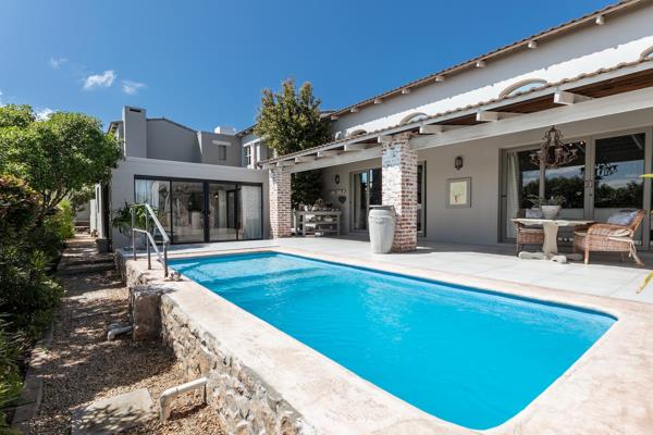 Step into a world of elegance and timeless beauty with this top-notch French-Mediterranean-inspired villa, gently tucked away in the heart of Langebaan. From the moment you arrive, you&#39;re greeted by a striking stone feature wall, complemented by a large window framing ...