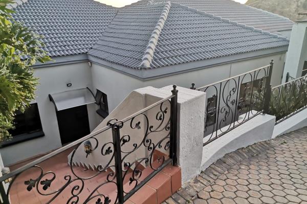 This stunning home in Rangeview, Krugersdorp, offers a perfect blend of luxury and ...