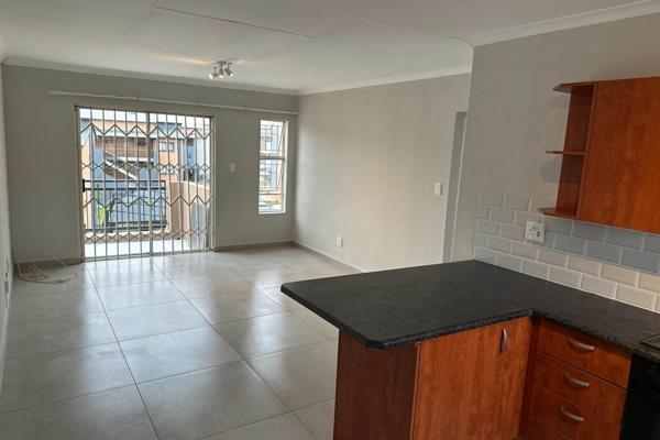 Lovely newly renovated north facing unit with open plan kitchen lounge area opening onto ...