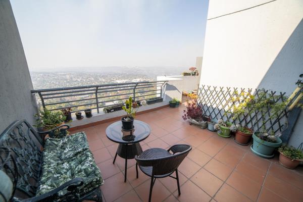 Welcome to this spacious penthouse apartment in Worlds View Northcliff! 

Upon entry, you are welcomed to the most spectacular open ...