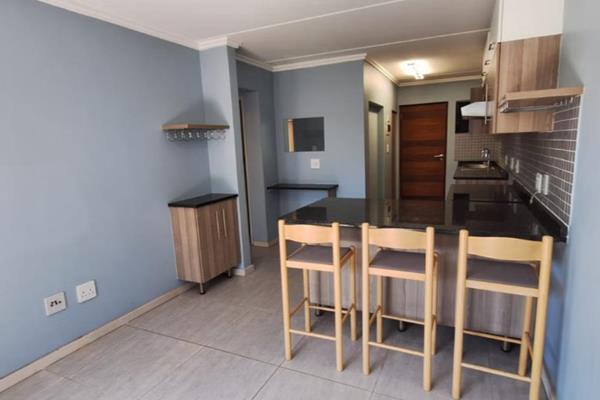 Welcome to this charming ground floor apartment at The Curve in Edenvale. This spacious 2-bedroom unit features an inviting open-plan ...