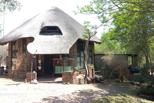 This stunning thatch and face brick octagon shaped house is situated in the  Hephzibah ...