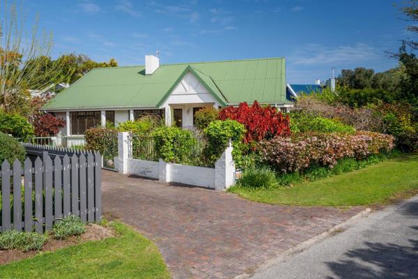 This garden sanctuary in the heart of Leisure Isle has a charming cottage with glimpses ...