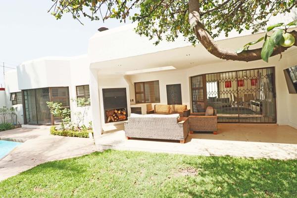 Tucked away in a secure complex within a boomed-off enclave, this stylish 4-bedroom ...