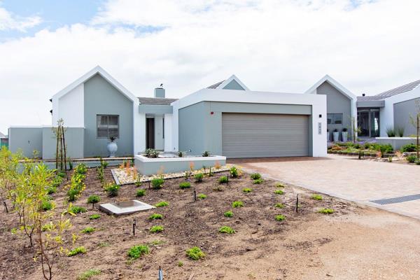 Dual Mandate
Step into a light-filled, meticulously designed home in Langebaan Country ...